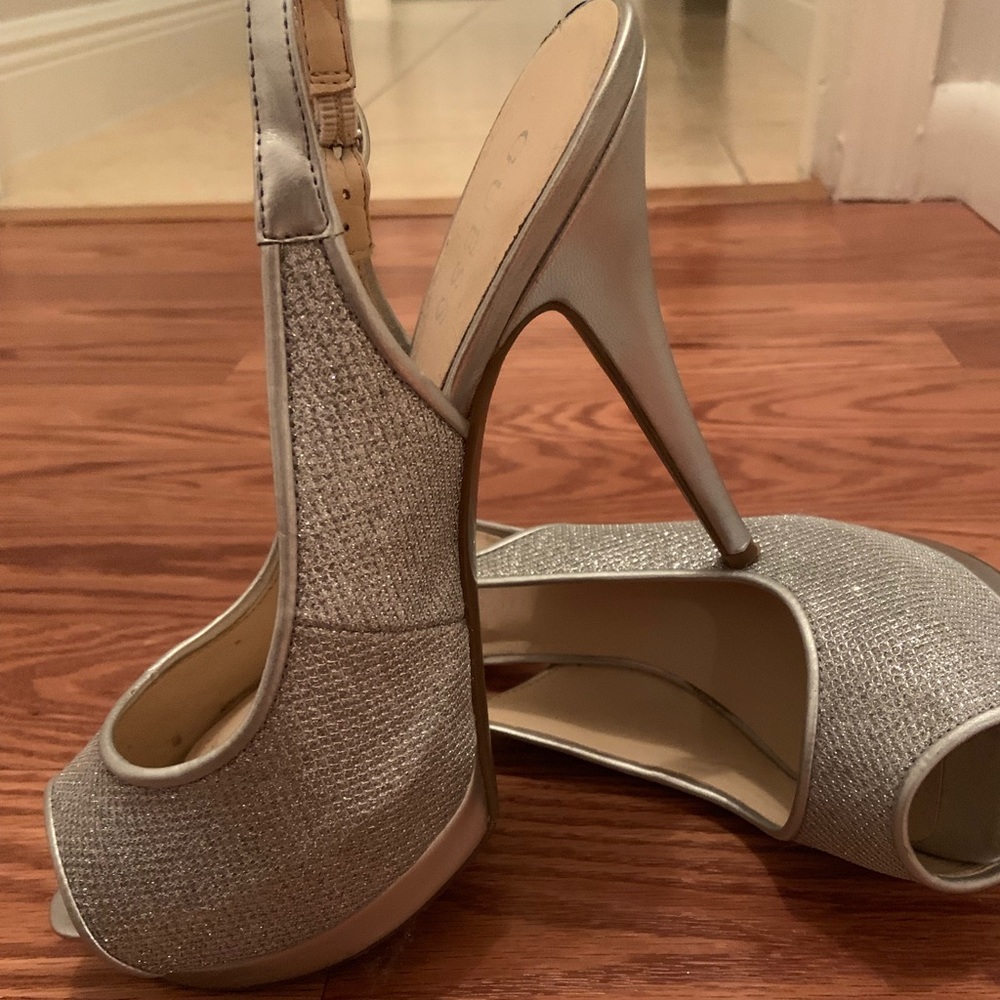 Silver peep toe heels by Guess